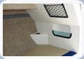 Additional features in the cabin: beverage holder and shelves for your personal items.
